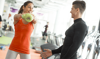 woman and man in gym